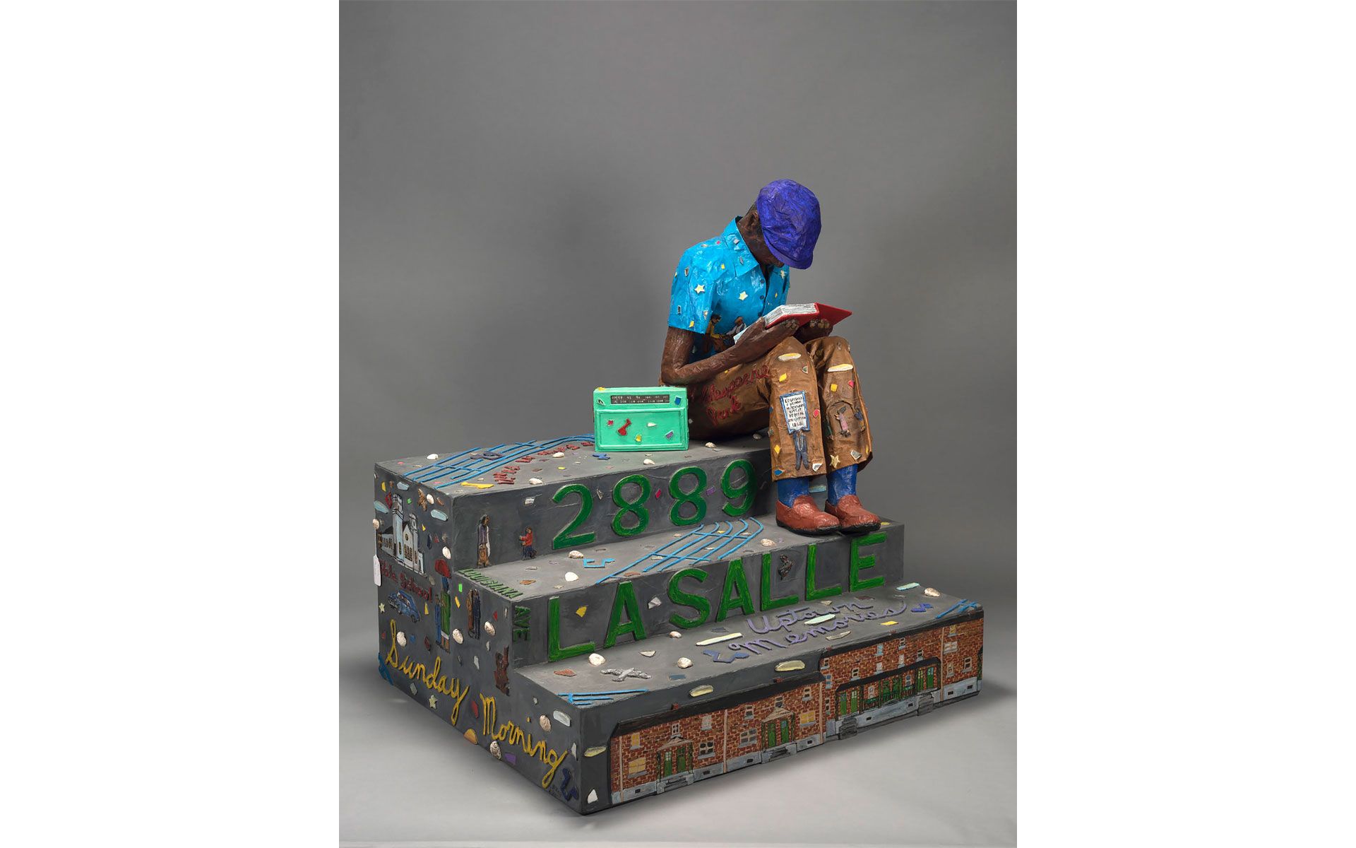 Uptown Memories (A Day in the Life of the Magnolia Project), by Willie Birch (1995). Painted papier-mâché and mixed media. New Orleans Museum of Art, Gift of Frederick R. Weisman. Image Copyright of New Orleans Museum of Art. Photo by Roman Alokhin. Uptown Memories (A Day in the Life of the Magnolia Project), by Willie Birch (1995). Painted papier-mâché and mixed media. New Orleans Museum of Art, Gift of Frederick R. Weisman. Image Copyright of New Orleans Museum of Art. Photo by Roman Alokhin.