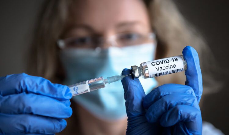COVID-19 coronavirus vaccine in doctor hands